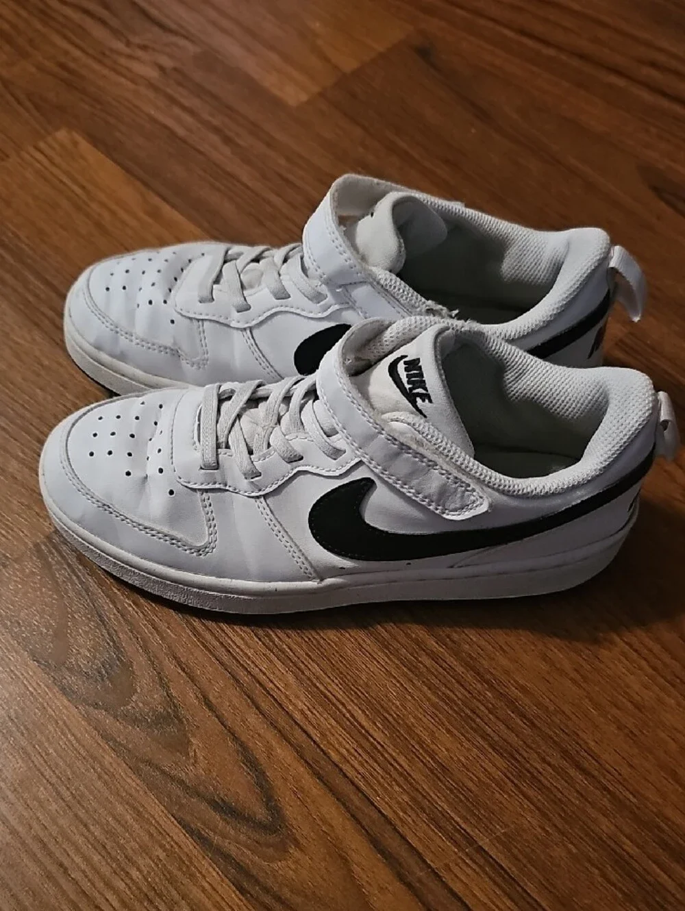 Nike Kids White Sneakers with Black Swoosh